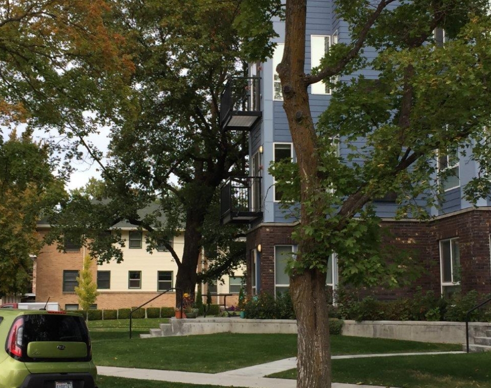 view to north similar brick and siding building